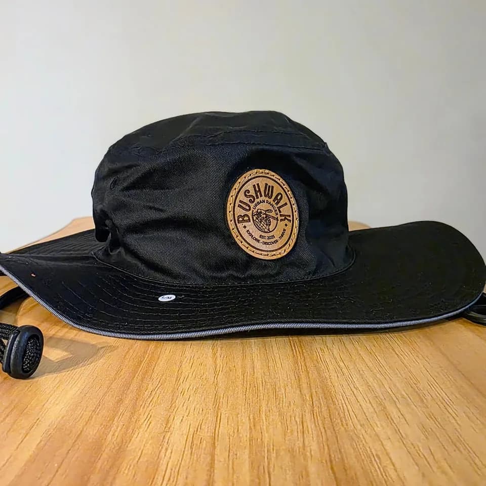 Round leather patch on a black boonie hat
