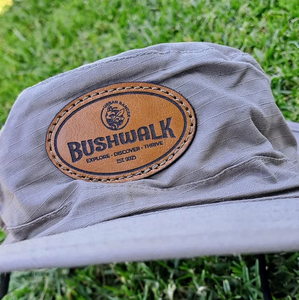 Oval leather patch on a grey bucket hat