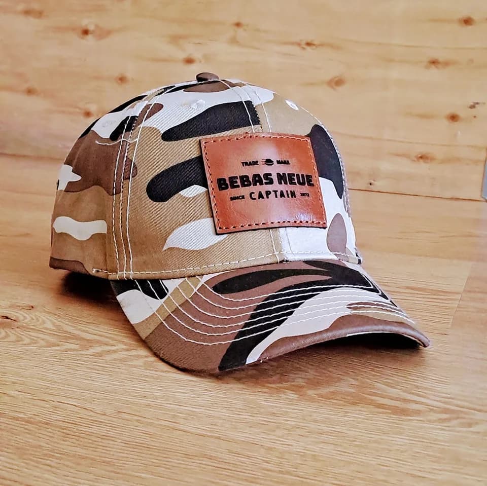 Rectangular leather patch on a camouflage cap