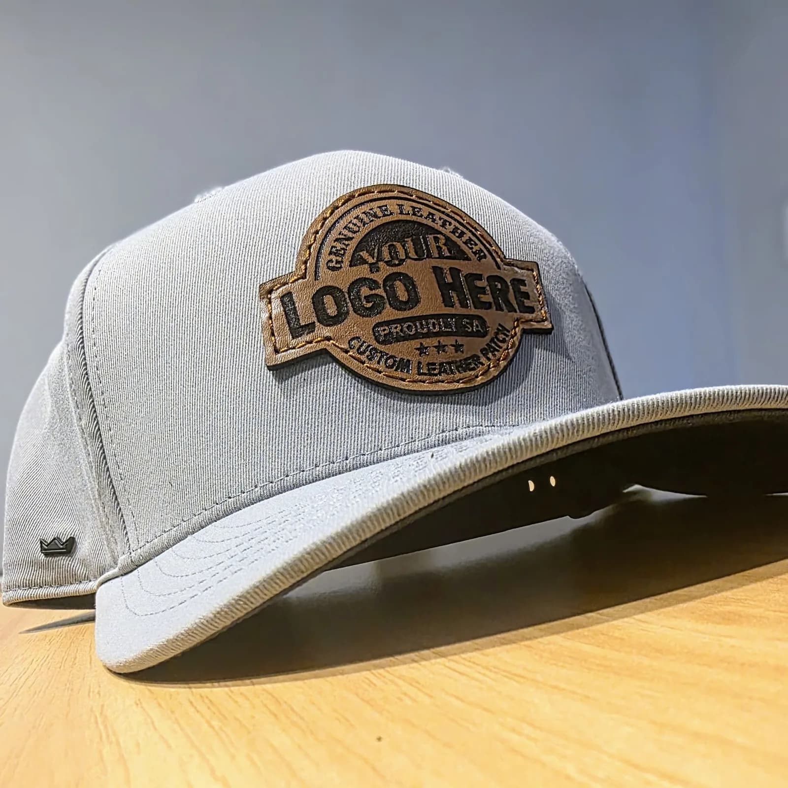 Engraved leather patch on a trucker cap